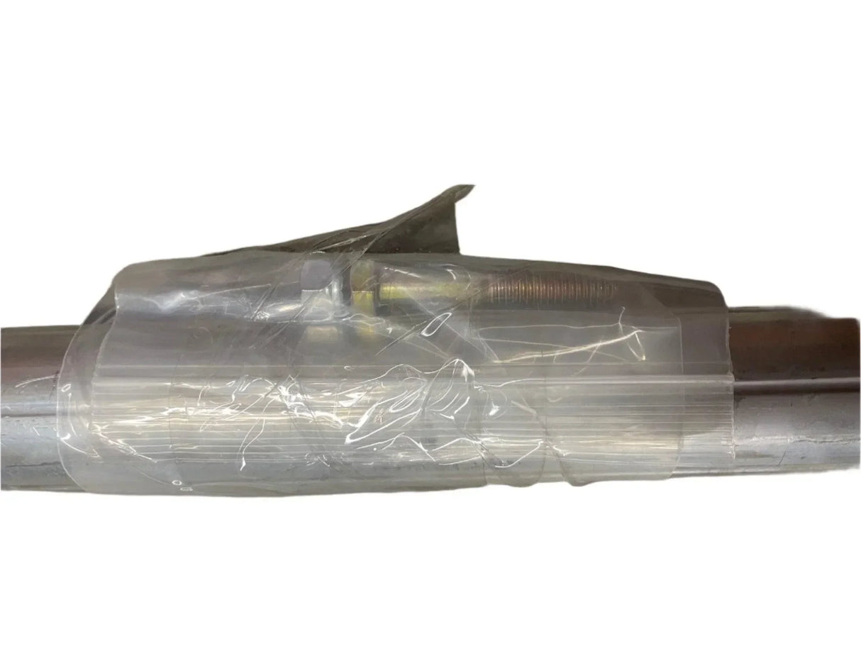 metal pipe wrapped in clear plastic protective film on white background