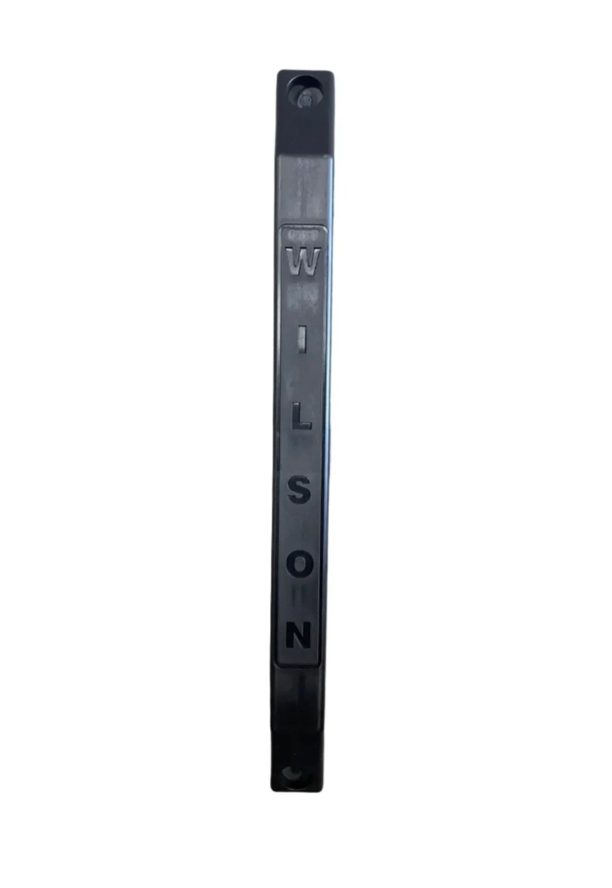 Black metal address sign post with raised WILSON letters on a white background