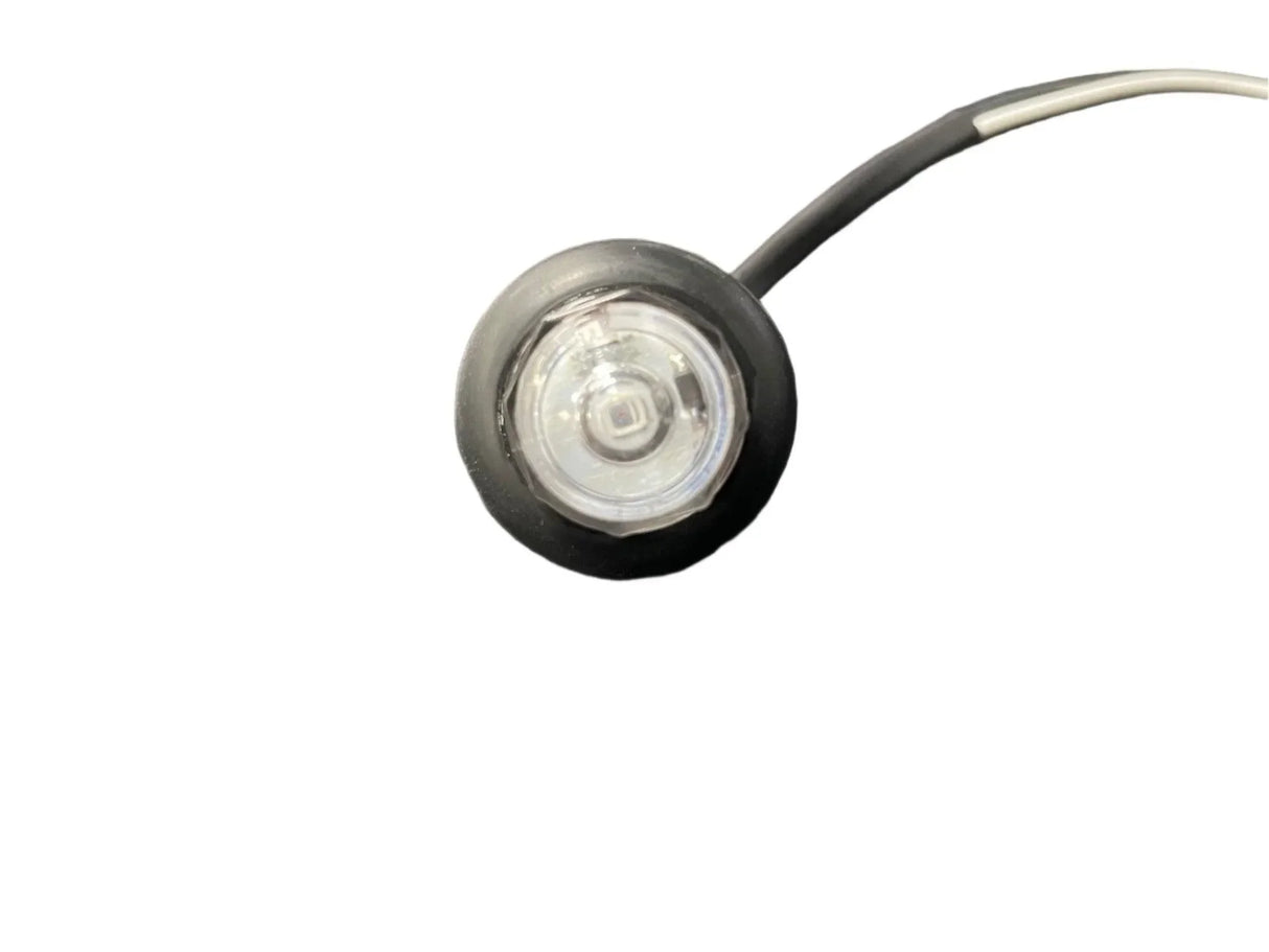 Round LED marker light with black housing and wire on white background