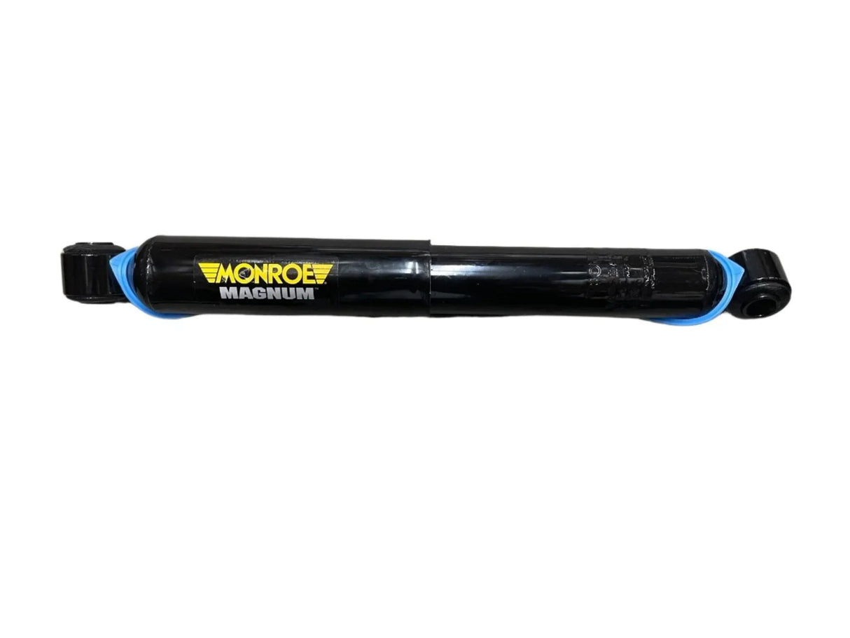 Monroe Magnum black shock absorber with yellow logo on white background