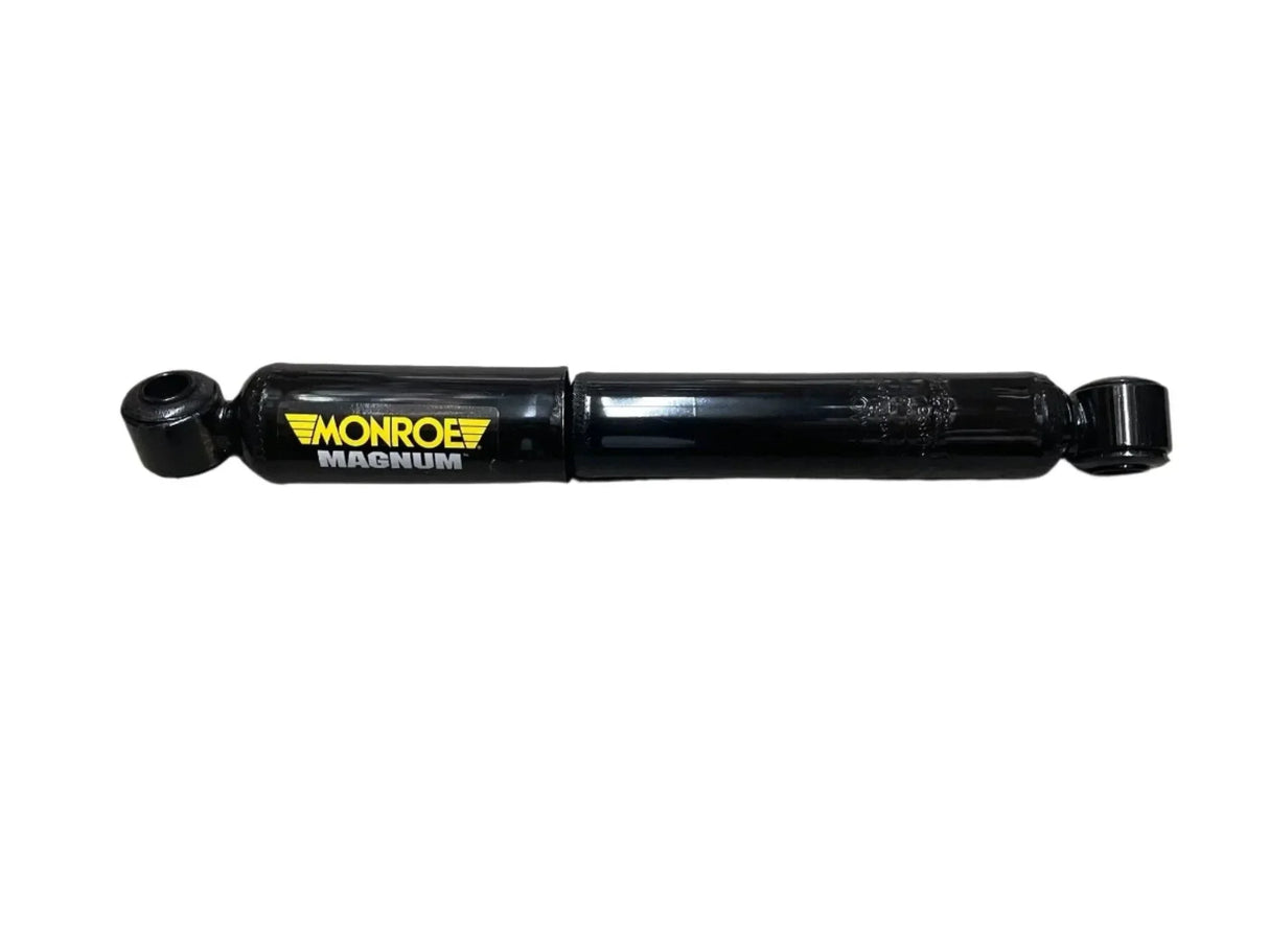 Monroe Magnum black shock absorber for trucks on white background