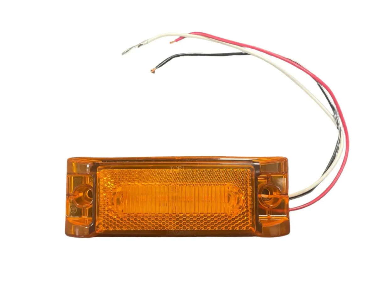 Amber LED side marker light with red, black, and white wires on white background