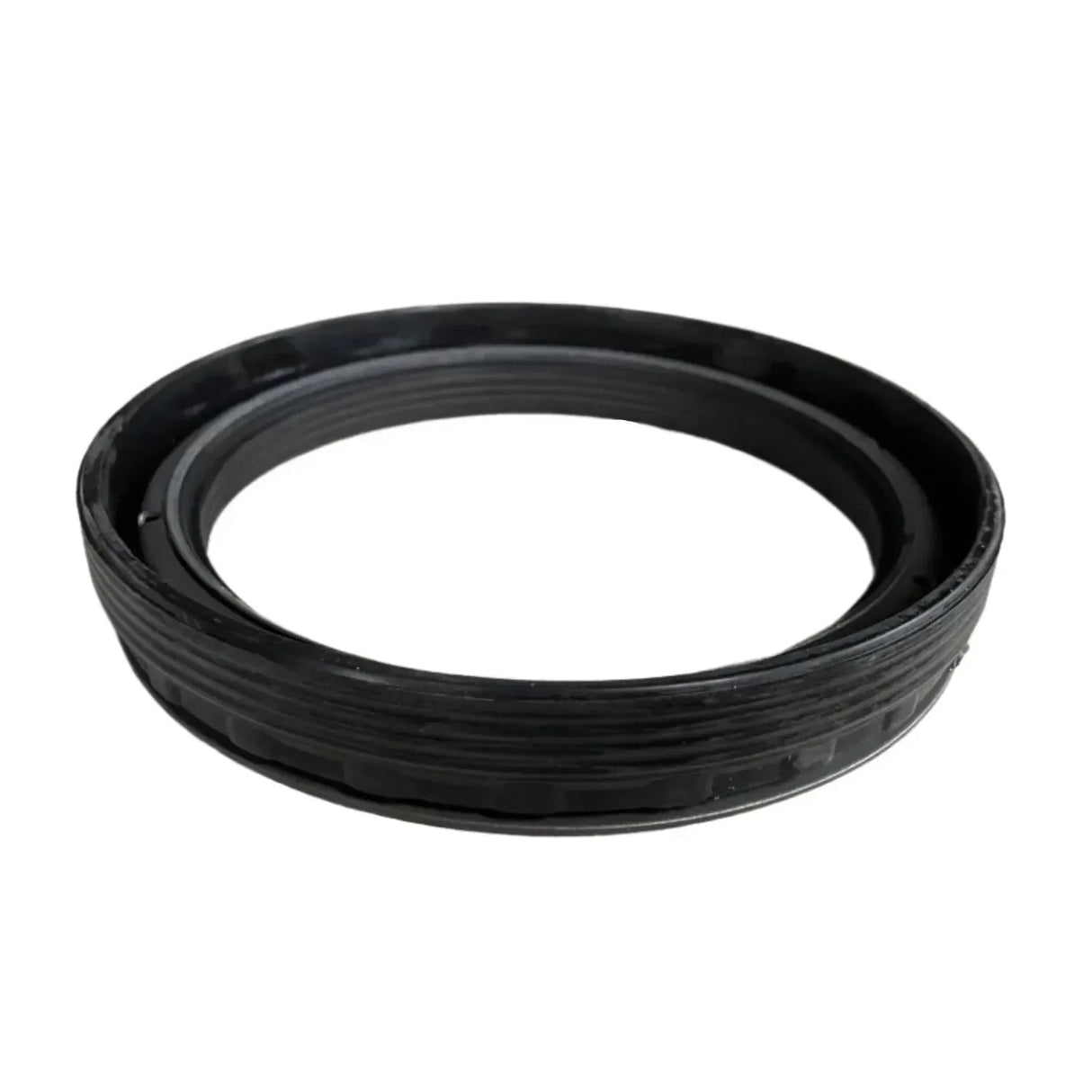 Black rubber oil seal gasket on white background, automotive replacement part