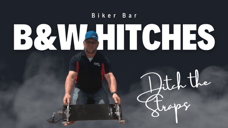 Man holding B&W Hitches biker bar with 'Ditch the Straps' text, promotional image