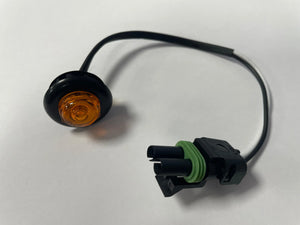 Amber LED round marker light with black housing and attached two-pin wiring connector