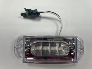 Clear LED automotive light with connector on white background
