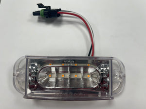 Clear LED trailer marker light with wiring and waterproof connector on white background
