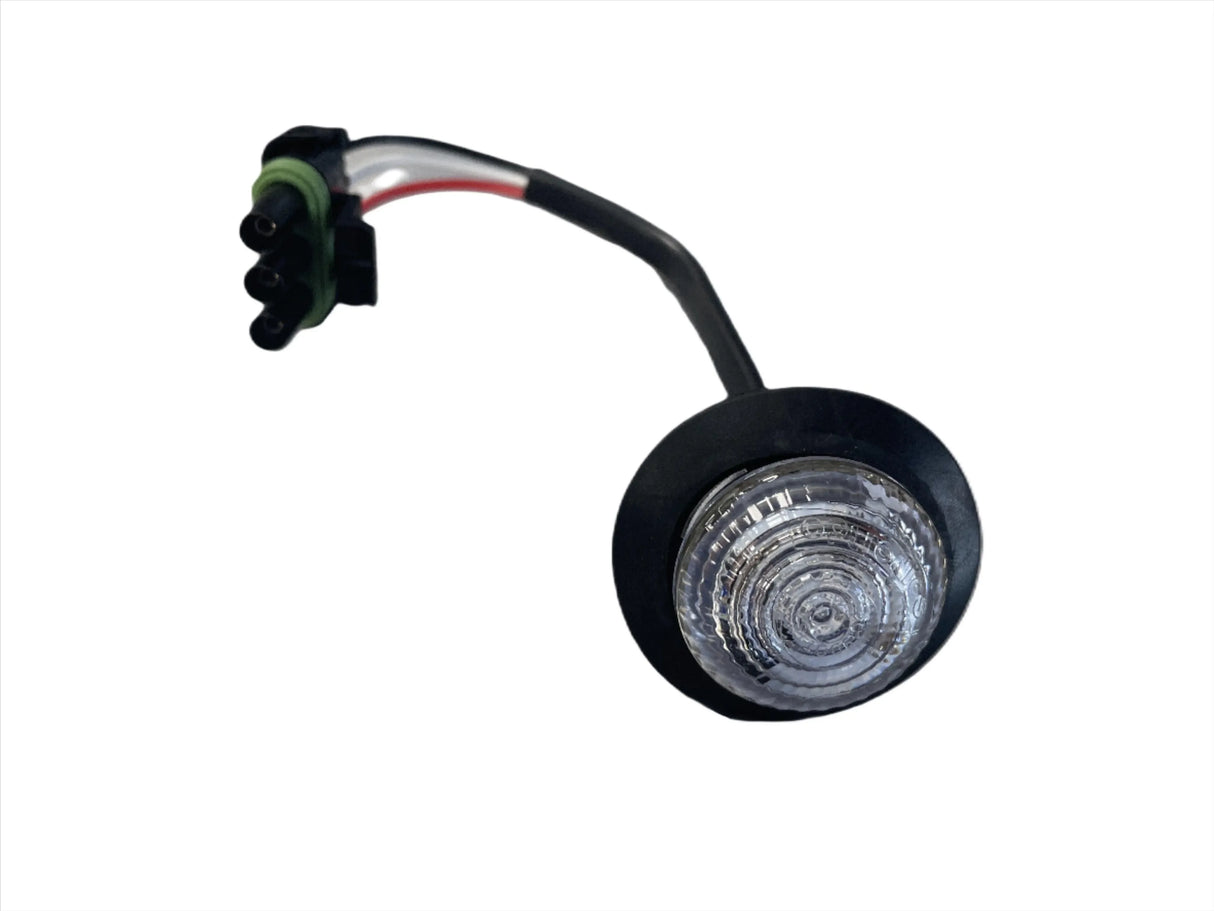 Round LED trailer marker light with clear lens and wire harness on white background