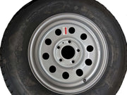 Tredit Texas Bragg Wheel/Tire Combo, 15" Radial — close-up of steel trailer wheel with eight lug holes and black tire, on white background