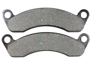 Pair of new motorcycle brake pads with metal backing and abrasive gray surface