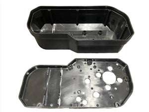 Black aluminum electronics enclosure case with exposed screw holes on a white background