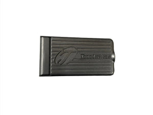 Black Thunderstone-branded metal money clip with grooved design on white background