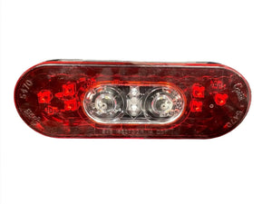 Red oval LED trailer tail light with clear center bulbs on white background
