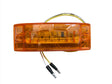 Grote amber LED marker light with dual wires, rectangular lens, isolated on white