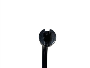 Close-up of a black plastic automotive fastener on white background