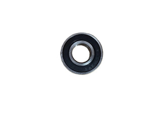 Single metal ball bearing with black seal on white background