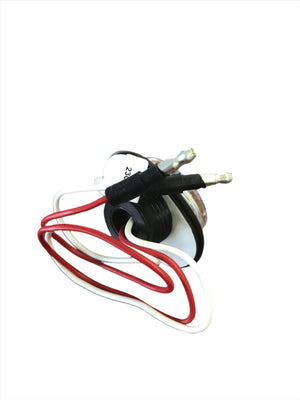 Close-up of electrical component with red and white wires on white background