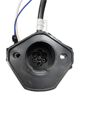 Close-up of a black 7-pin trailer plug connector with attached wiring
