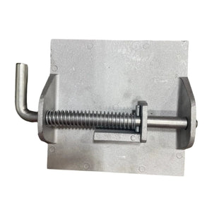 Metal bench vise screw clamp with handle on a plain background