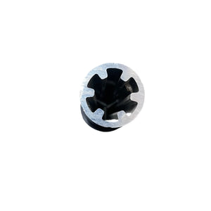 Close-up of a metal extrusion with star-shaped inner profile on white background