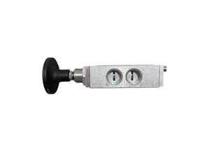 Close-up of a metal pneumatic valve with black knob and two adjustment screws on white background