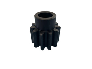 Black metal gear with straight teeth on white background, industrial machine part