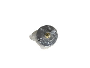 Metal cylinder with brass center, wrapped in plastic, on white background