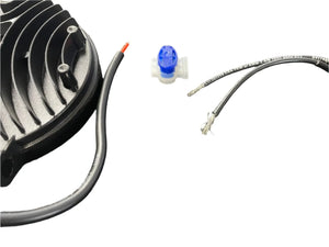 Black LED light housing with exposed wires and a blue electrical wire connector on white background