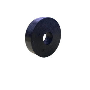Black rubber washer with center hole on white background, industrial hardware part