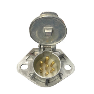 7 pin trailer connector plug with metal cover and gold pins on white background
