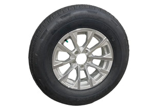 Silver alloy wheel with Rainier ST radial tire on white background