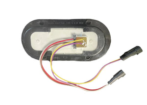 Oval LED trailer light wiring harness with red, yellow, and white wires and connectors