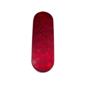 Red oval LED trailer tail light with six circular reflector patterns, white background