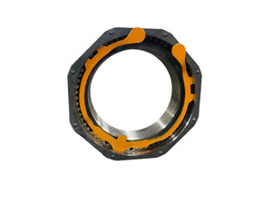 Heavy duty axle nut with yellow locking ring on white background, automotive component