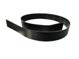 Black flat drive belt coiled on white background for industrial machinery