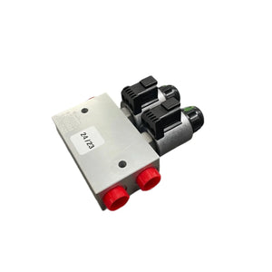 Hydraulic solenoid valve with red caps and dual connectors on a white background