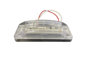 Clear LED license plate light with red and white wires on a white background