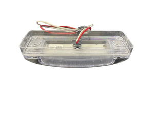 clear LED trailer license plate light with red and white wires on a white background