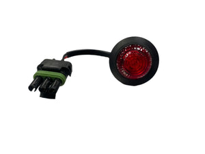 Round red LED marker light with black connector and green gasket on white background