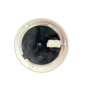 Round metallic electrical floor box cover with black plastic center and label, isolated on white