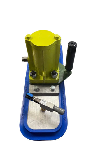 Industrial vacuum lifter with yellow metal housing, blue rubber base, and control valve