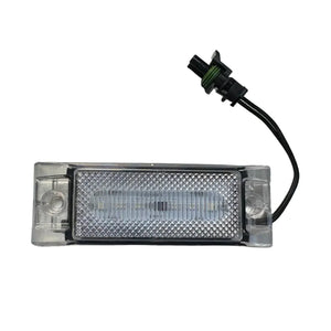 Clear rectangular LED license plate light with wiring and connector on white background