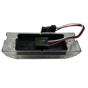 Clear LED license plate light with black housing and attached wiring harness