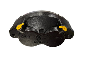 Black Dexter brake caliper with yellow plugs on a white background