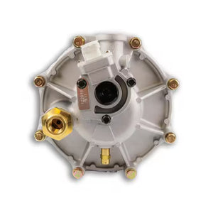 Round silver LPG regulator with brass fittings, automotive gas reducer close-up
