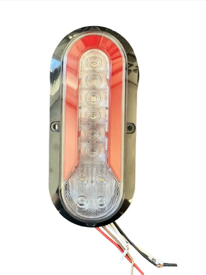 Oval LED tail light with red and clear lens, chrome trim, and exposed wiring