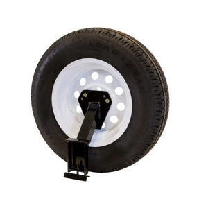Trailer spare tire with white steel rim and black mounting bracket on white background