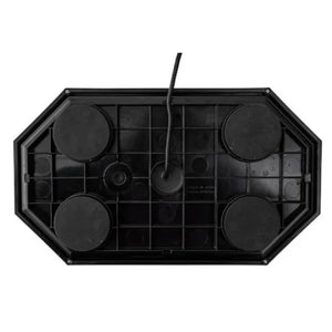 underside view of black plastic electronic device with four round feet and center cable
