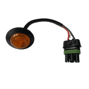Round amber LED marker light with black mounting base and three-wire connector