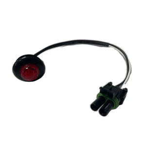 Round red LED marker light with black housing and attached wiring harness